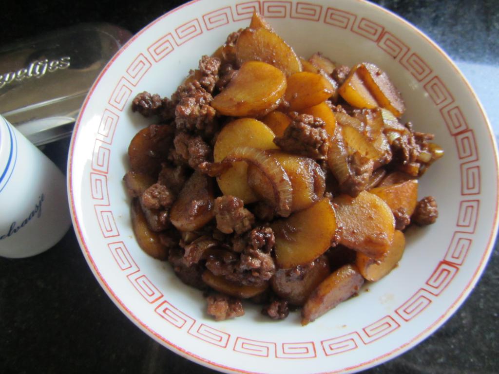 Stew potatoes with cabbage and meat