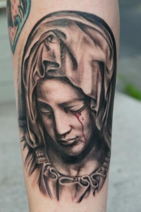 tatovering på et religiøst tema